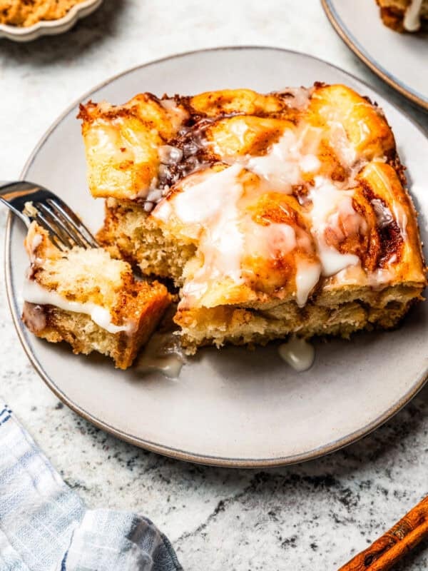 Cinnamon roll casserole piece served on a plate.