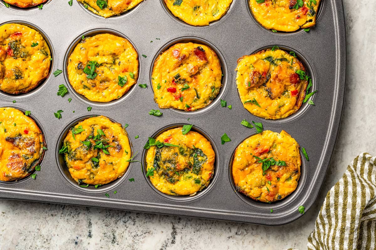 This Starbucks-inspired egg bites recipe with cottage cheese and veggies is quick to bake in a muffin tin. It's an easy, on-the-go breakfast! Baked egg bites in a muffin pan.