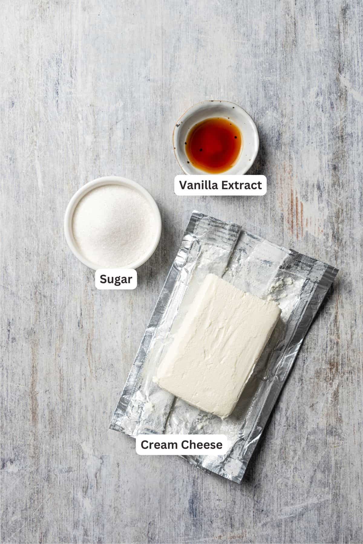 These easy, soft-baked sweet potato cookies are made with sweet potato purée, fall spices, and stuffed with sweet cream cheese in the middle! Sweet cream cheese filling ingredients with text labels overlaying each ingredient.