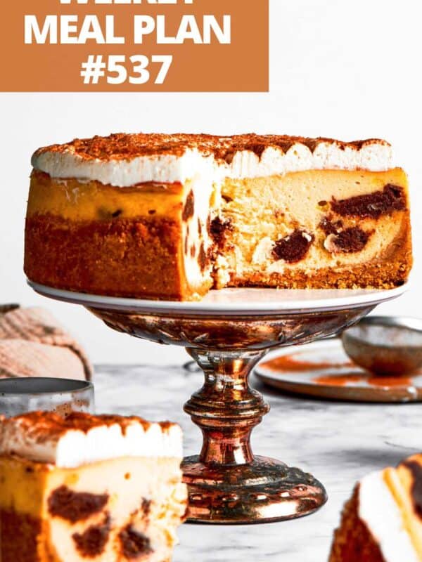 Cinnamon Roll Cheesecake on a cake plate.