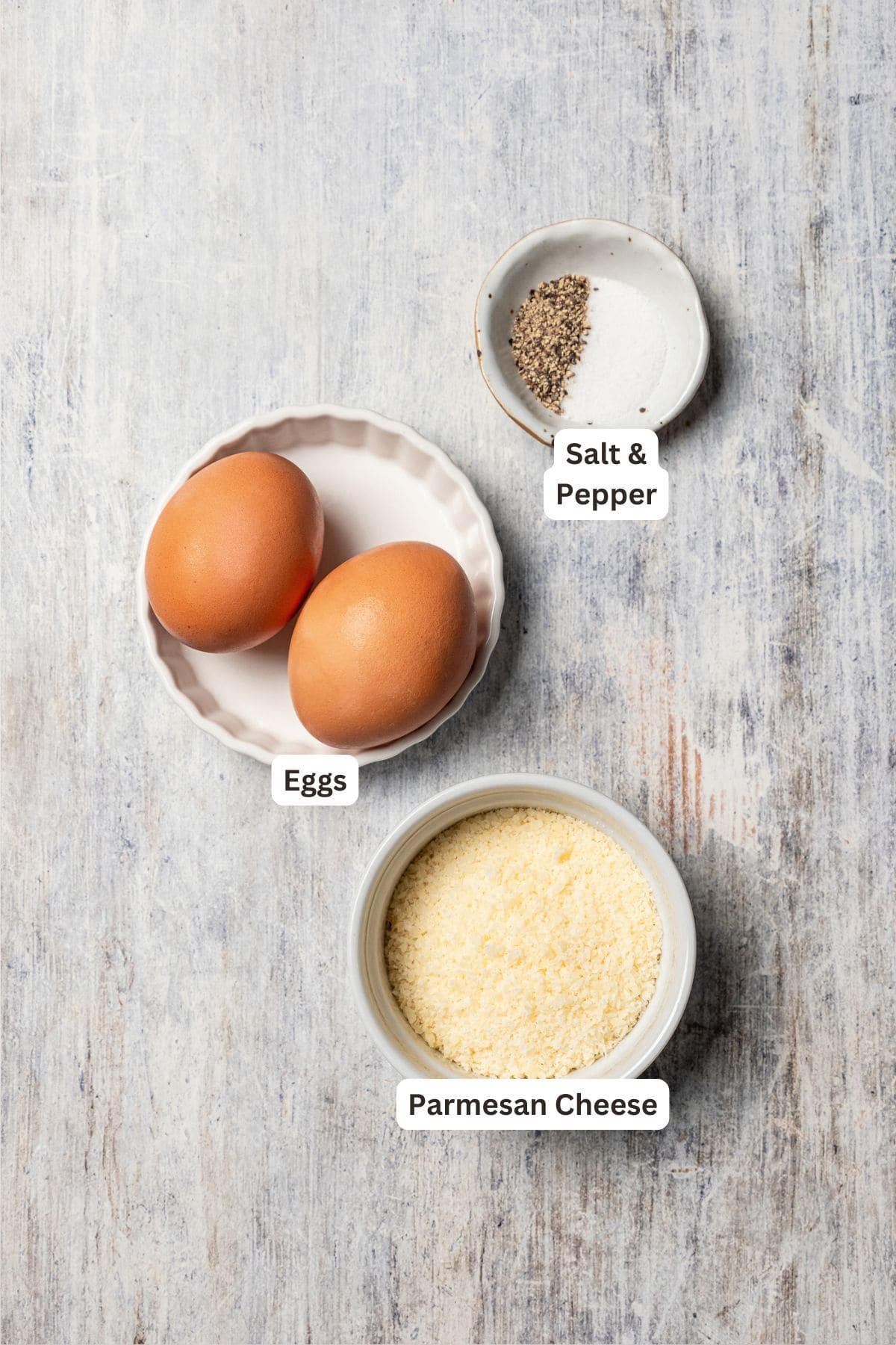 This chicken and bacon pasta is a 20-minute meal with tender linguine, juicy chicken, bacon, and parmesan in a creamy, Carbonara-style sauce. Egg sauce ingredients with text labels overlaying each ingredient.