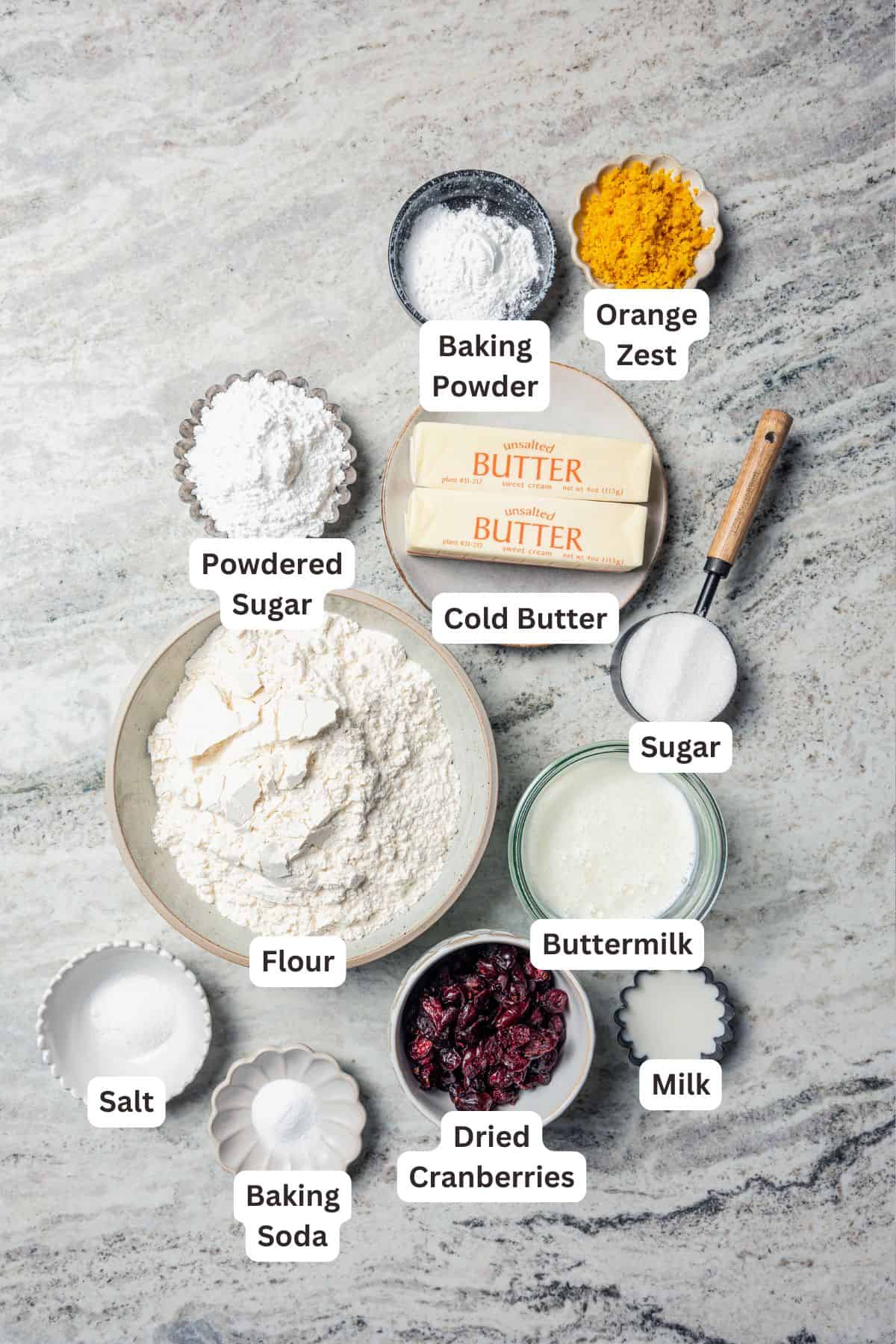 Cranberry orange scone ingredients with text labels overlaying each ingredient.