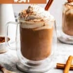 Eggnog latte in a glass mug.