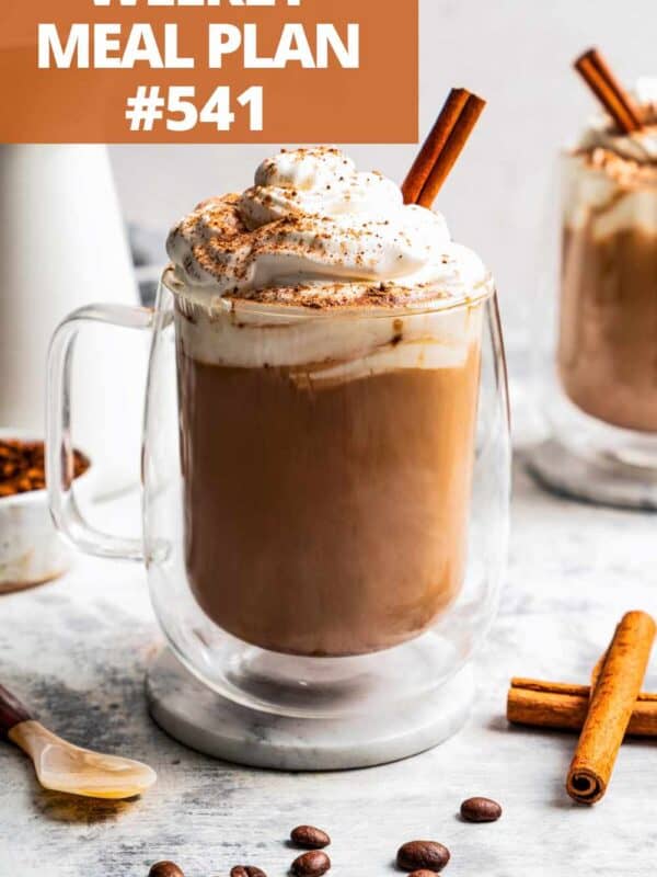 Eggnog latte in a glass mug.