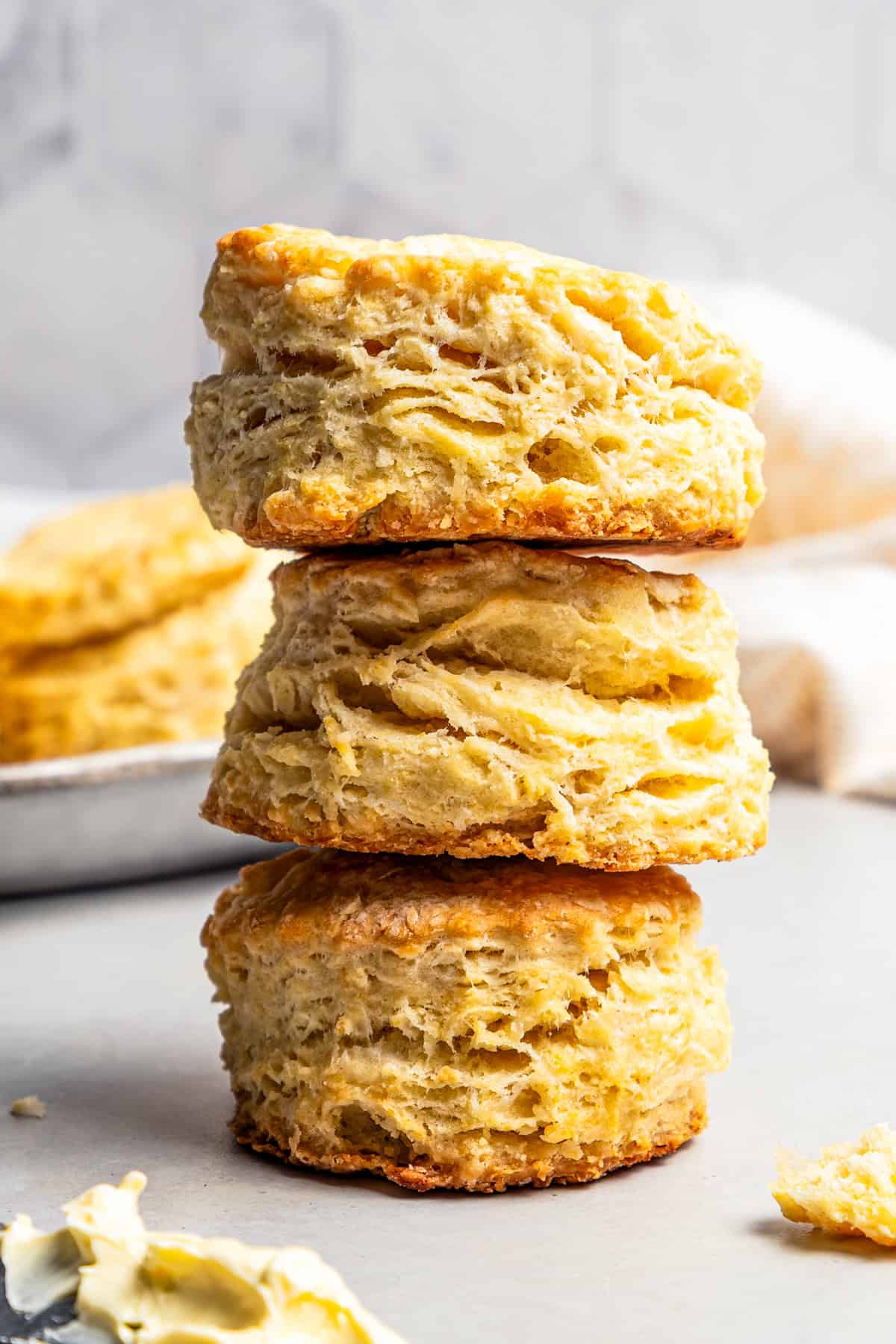 A stack of three buttermilk biscuits.