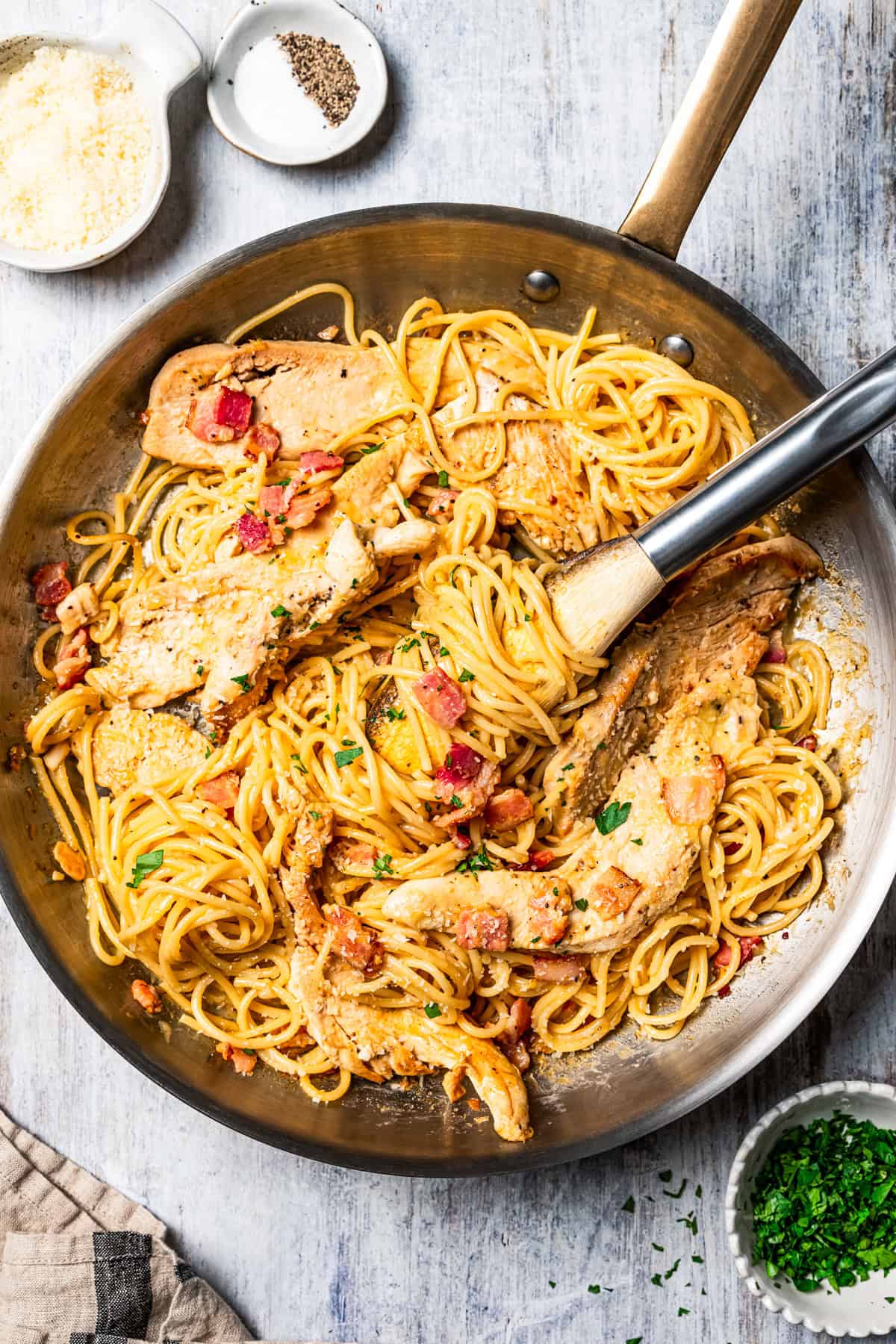 This chicken and bacon pasta is a 20-minute meal with tender linguine, juicy chicken, bacon, and parmesan in a creamy, Carbonara-style sauce. Creamy chicken and bacon pasta in a skillet.