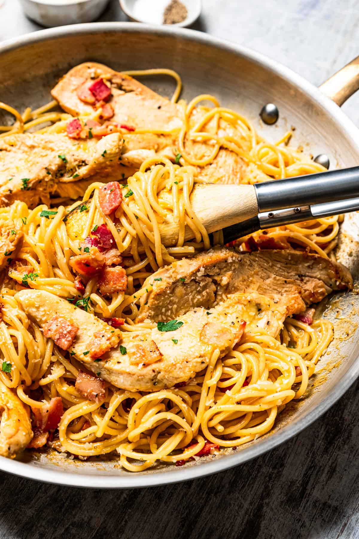 This chicken and bacon pasta is a 20-minute meal with tender linguine, juicy chicken, bacon, and parmesan in a creamy, Carbonara-style sauce. Creamy chicken and bacon pasta in a skillet.