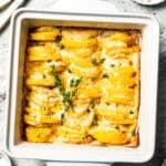 Baked scalloped potatoes in a baking dish.