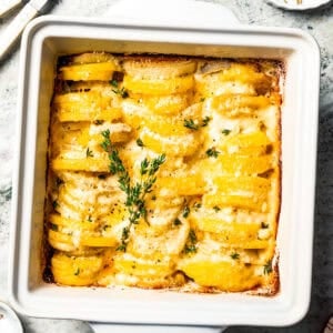 Baked scalloped potatoes in a baking dish.