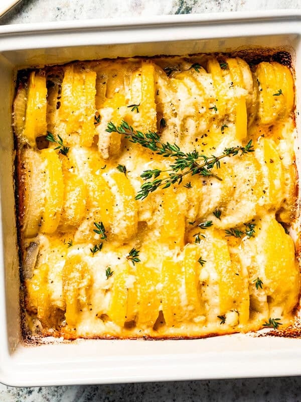 Baked scalloped potatoes in a baking dish.