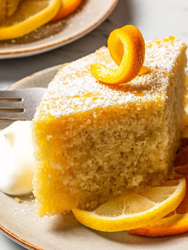 A diamond-shaped slice of semolina cake on a dessert plate.