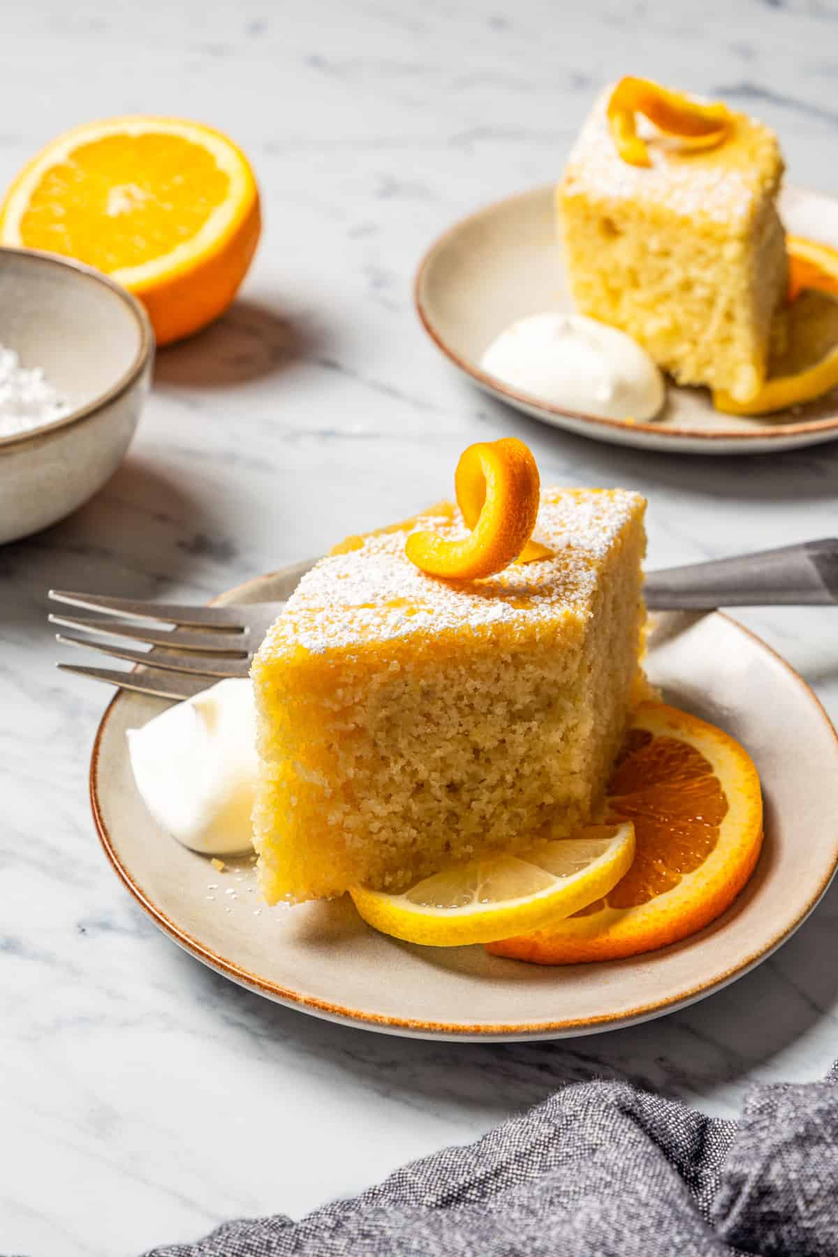 A slice of Macedonian semolina cake, also known as Ravanija, served on a dessert plate.