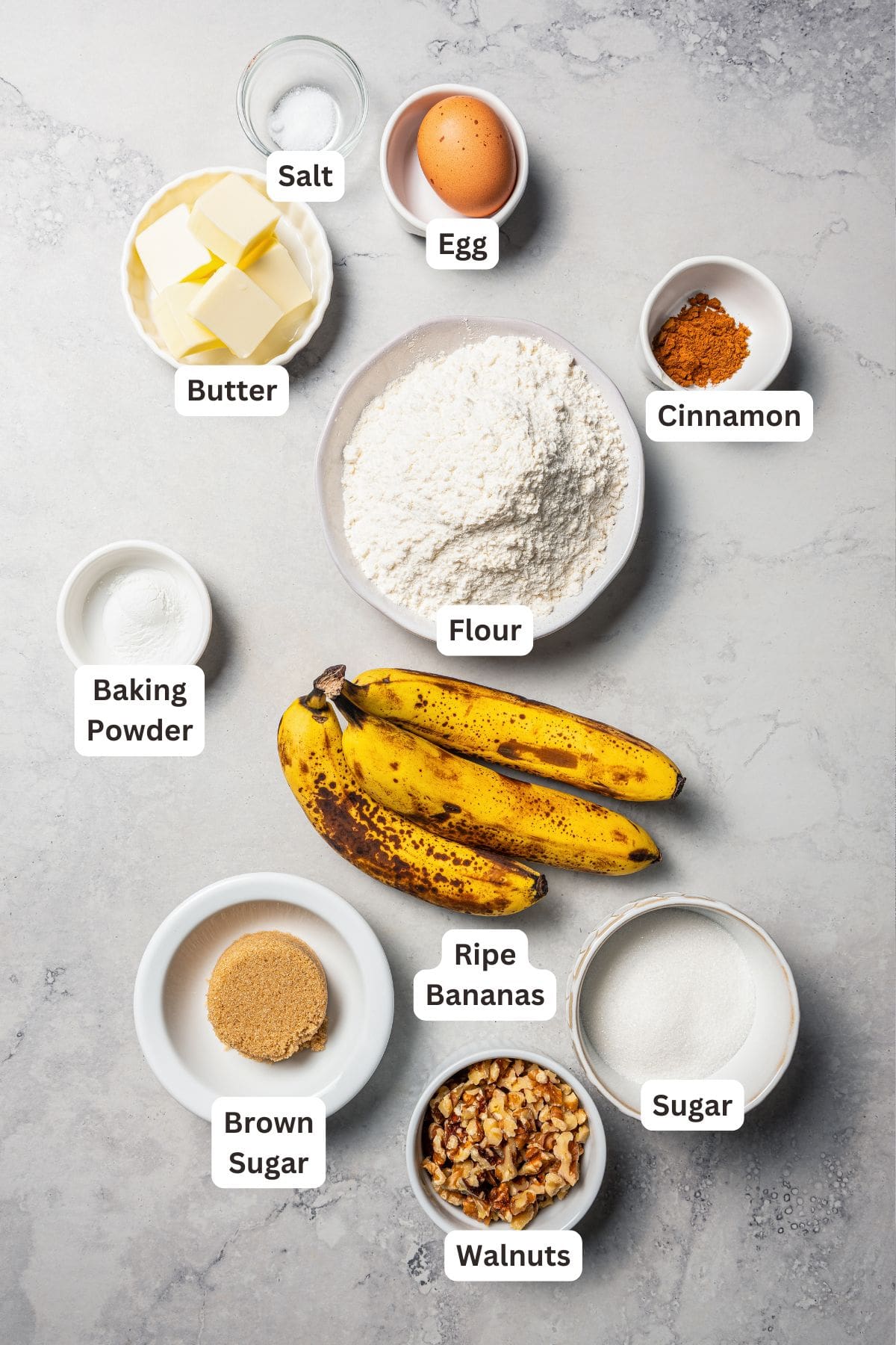 Banana nut muffins ingredients with text labels overlaying each ingredient.