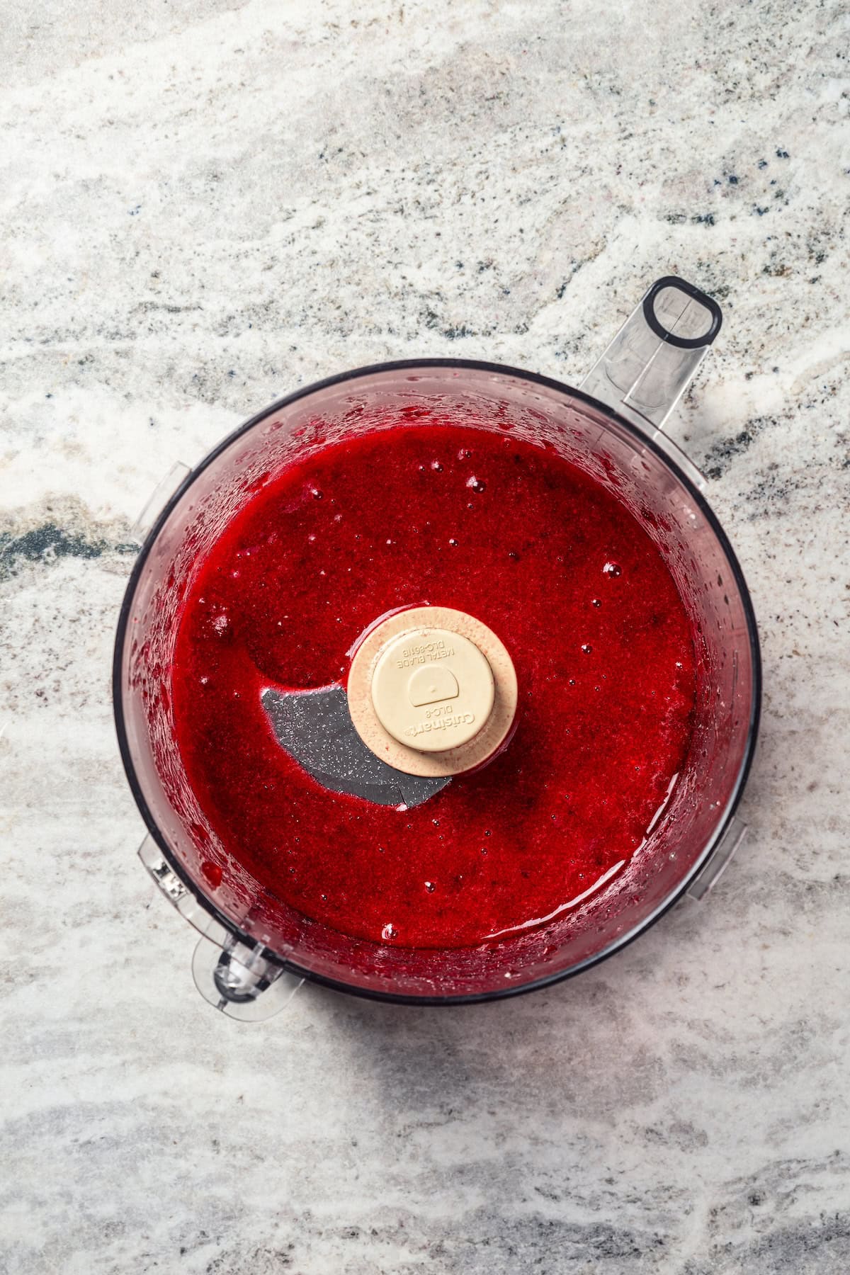 Pumpkin pancakes are the best fall breakfast! Made from pancake mix, real pumpkin, and spices, topped with cranberry syrup for the holidays. Cooked cranberries blended with maple syrup inside a food processor.