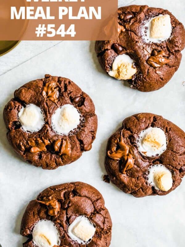 Four hot chocolate cookies topped with marshmallows.