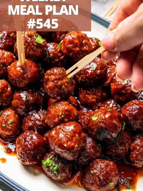 A bowl of grape jelly meatballs with toothpicks for easy grabbing.