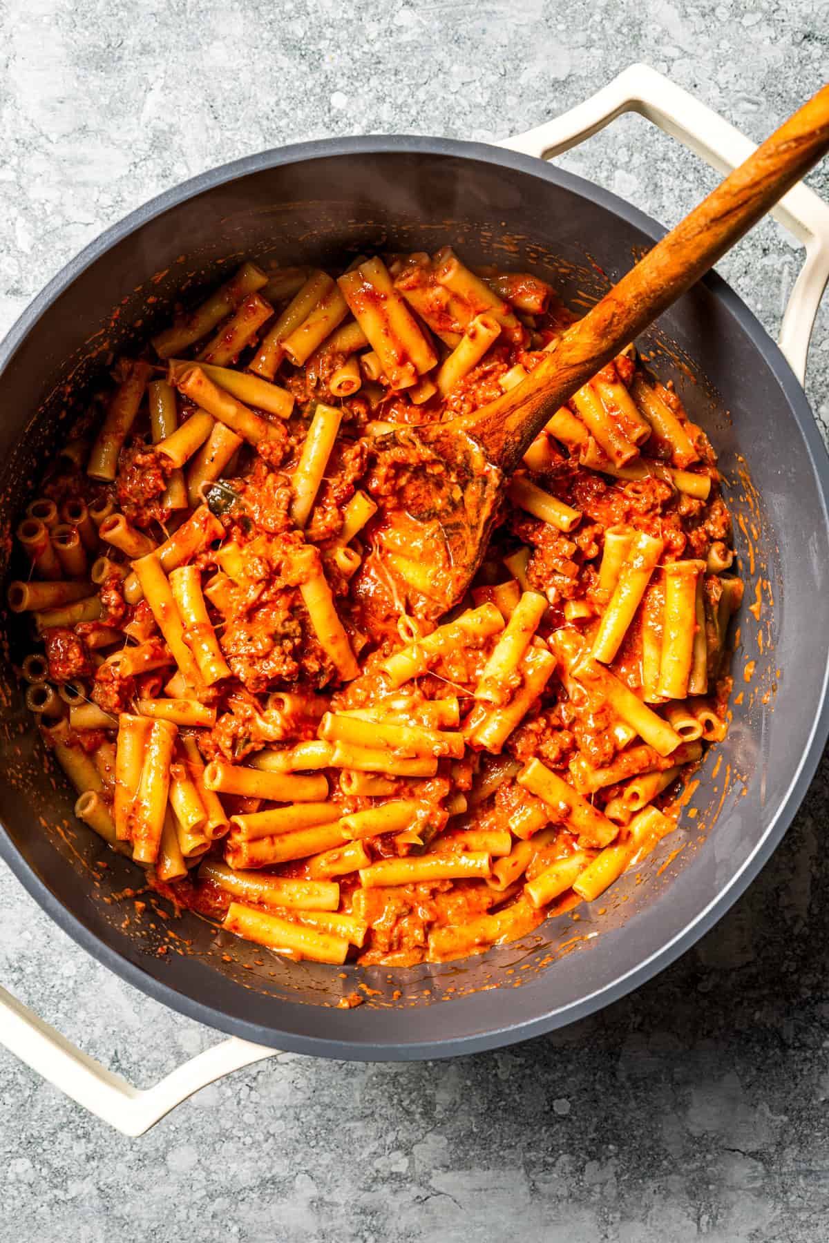 My easy baked ziti recipe is a weeknight-friendly pasta casserole with rich homemade meat sauce and three kinds of melty Italian cheese.