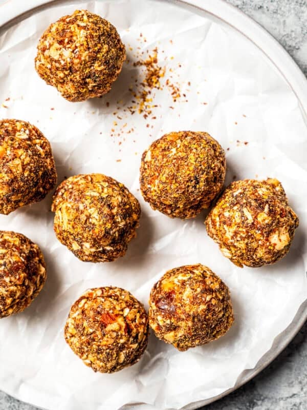 Gingerbread energy bites arranged on a plate.