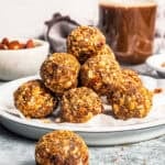 A stack of gingerbread energy bites on a plate.