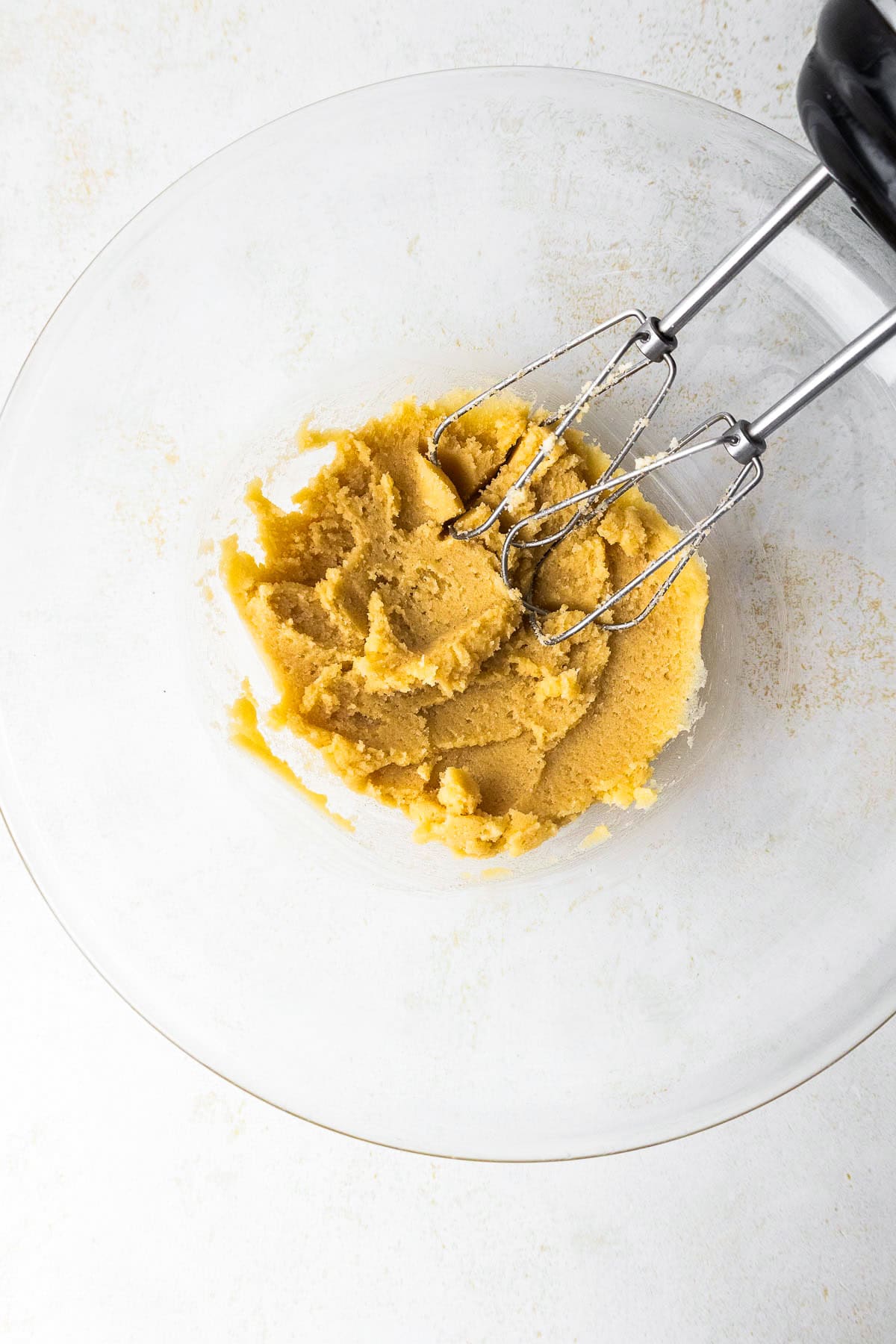 This peanut butter blossoms recipe makes soft, thick peanut butter cookies topped with a chocolate kiss. Easy to make and perfect for any occasion. Creaming butter and sugar with a mixer.