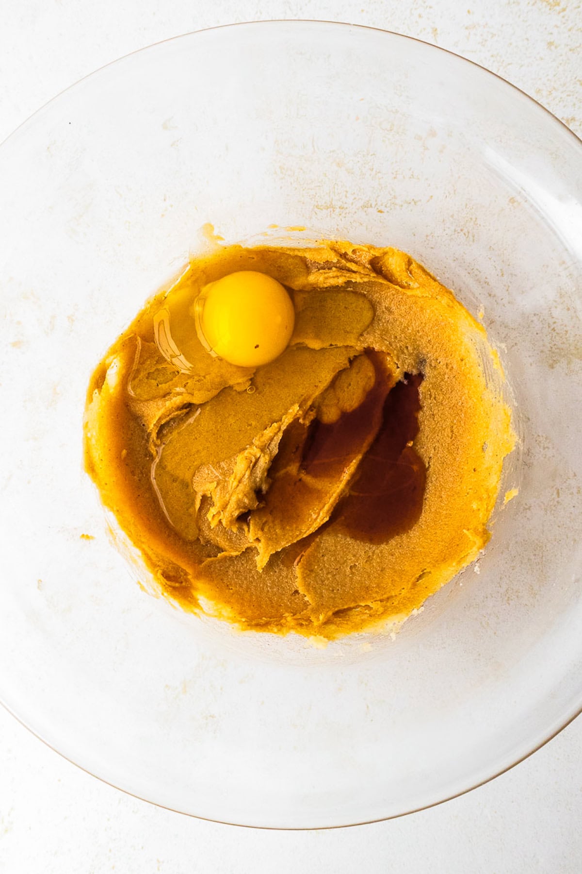 This peanut butter blossoms recipe makes soft, thick peanut butter cookies topped with a chocolate kiss. Easy to make and perfect for any occasion. Egg and vanilla to be mixed into the peanut butter cookie dough.