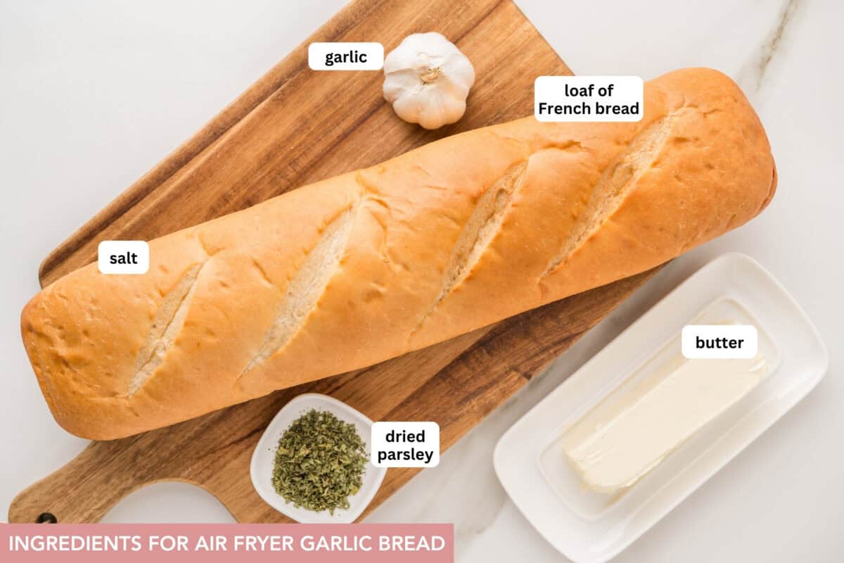 This tasty and easy air fryer garlic bread has crisp edges, a soft buttery center, and bold garlic flavor. A fast, oven-free side dish ready in 5 minutes. A photo of all the ingredients needed to make garlic bread.