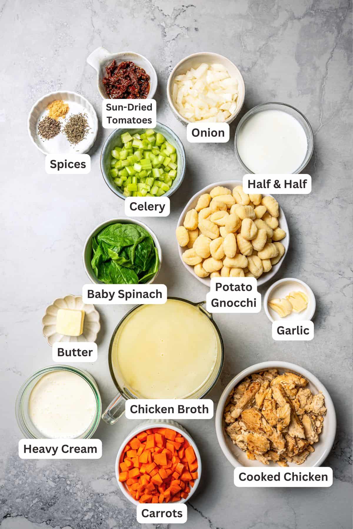 This chicken gnocchi soup is even better than the Olive Garden! It's ready in 20 minutes, extra creamy, and packed with flavorful ingredients. Chicken gnocchi soup ingredients with text labels overlaying each ingredient.