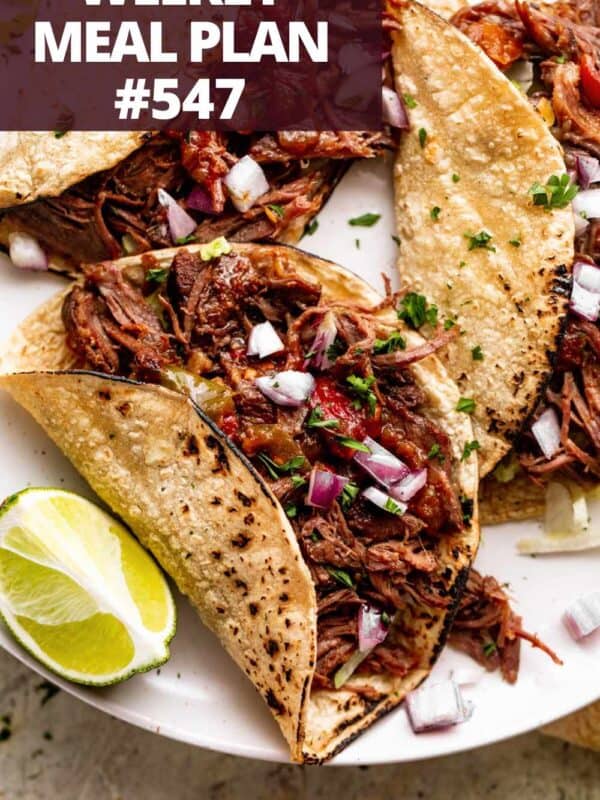 Beef machaca tacos on a plate.