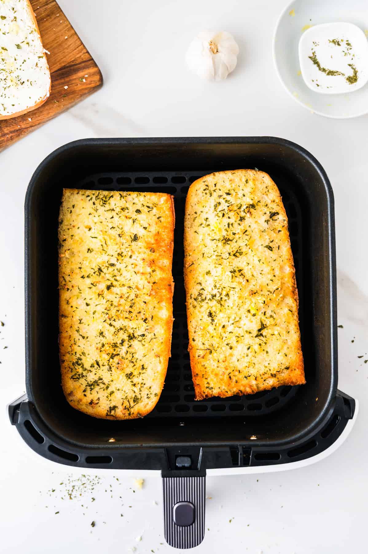 This tasty and easy air fryer garlic bread has crisp edges, a soft buttery center, and bold garlic flavor. A fast, oven-free side dish ready in 5 minutes. Cooked garlic bread in an air fryer basket.