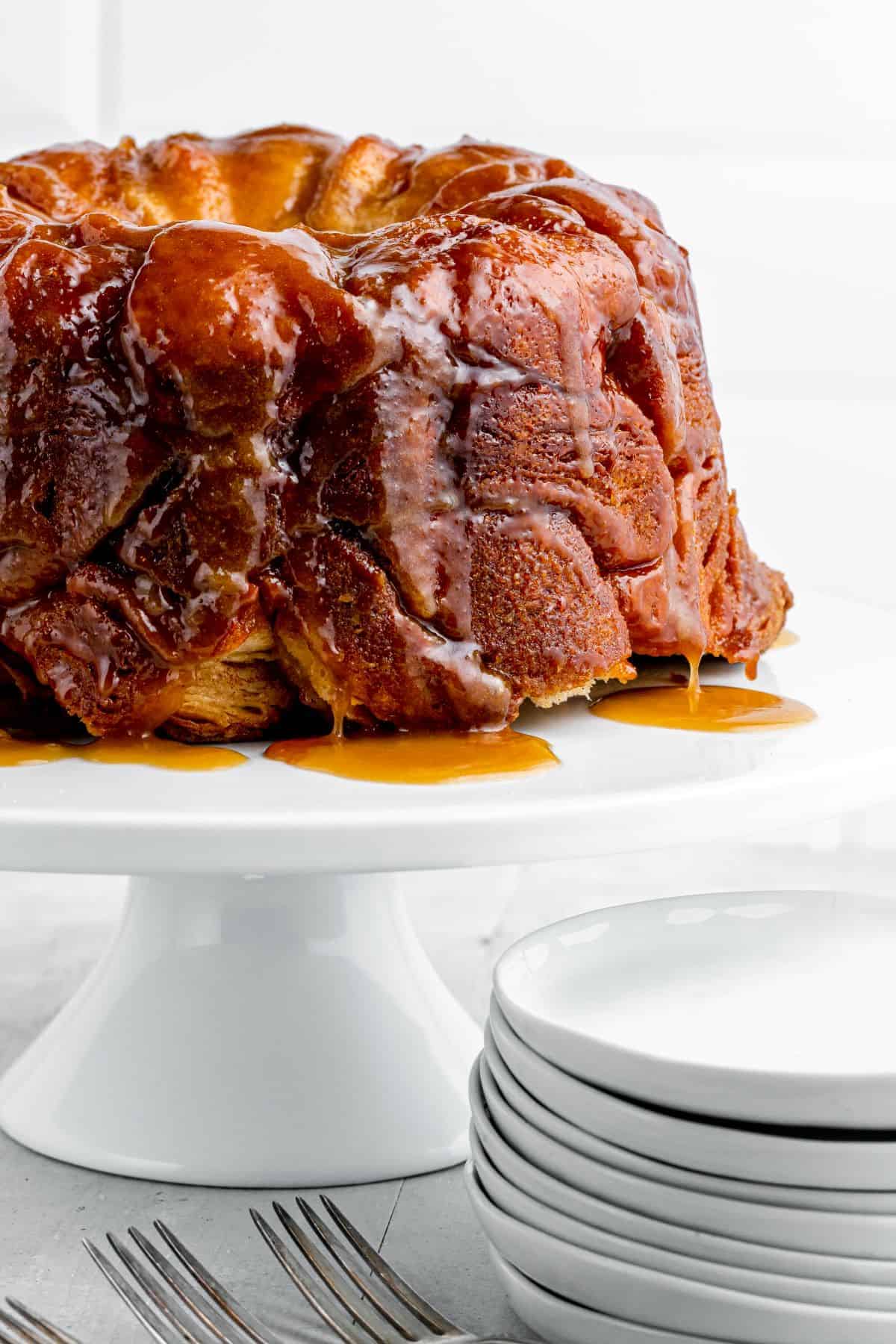 Bundt pan monkey bread served on a cake plate.