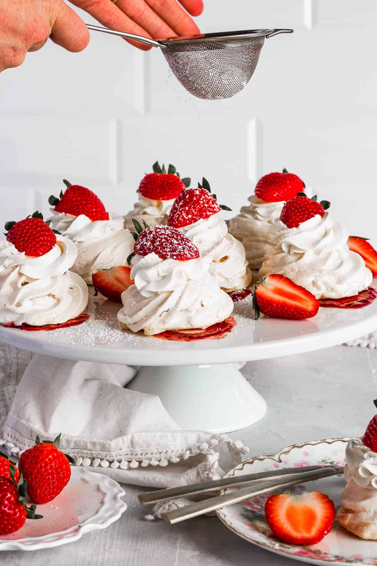 Weekly Meal Plan Pavlova nests on a cake platter.
