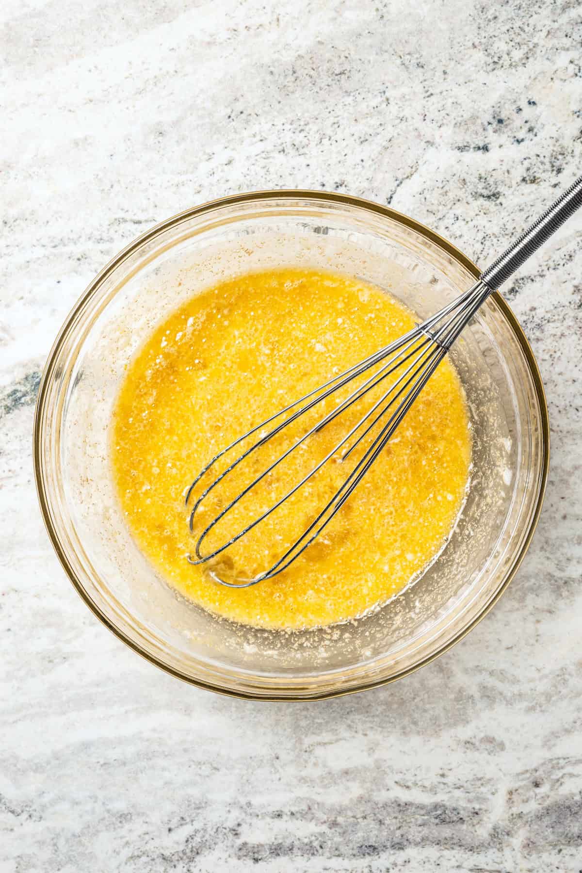 Wet ingredients whisked together in a bowl.