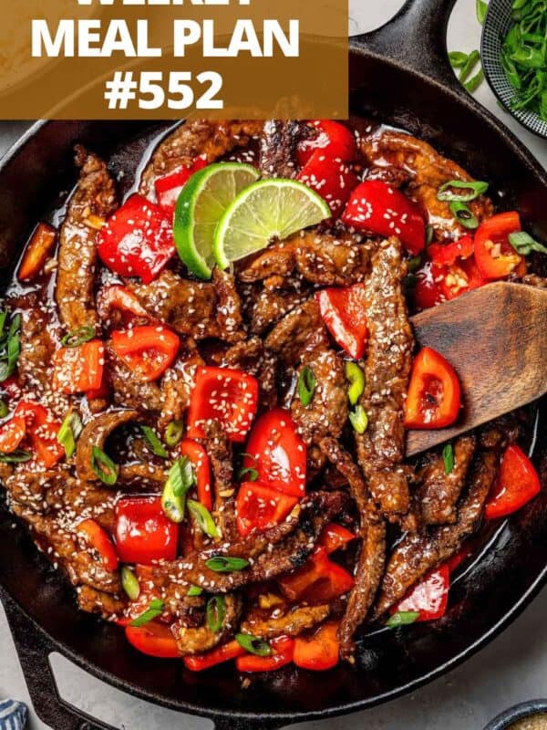 Thinly sliced beef and chopped vegetables in a skillet.