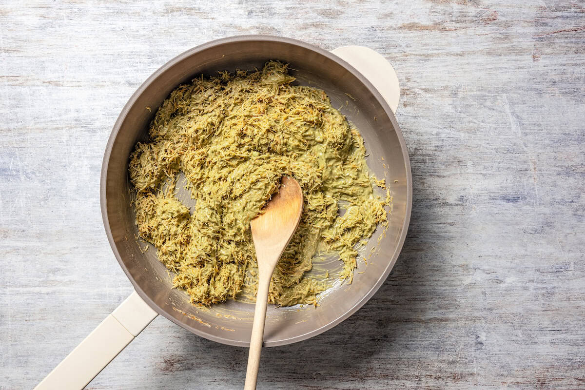 Pistachio cream stirred into toasted pastry in a skillet.