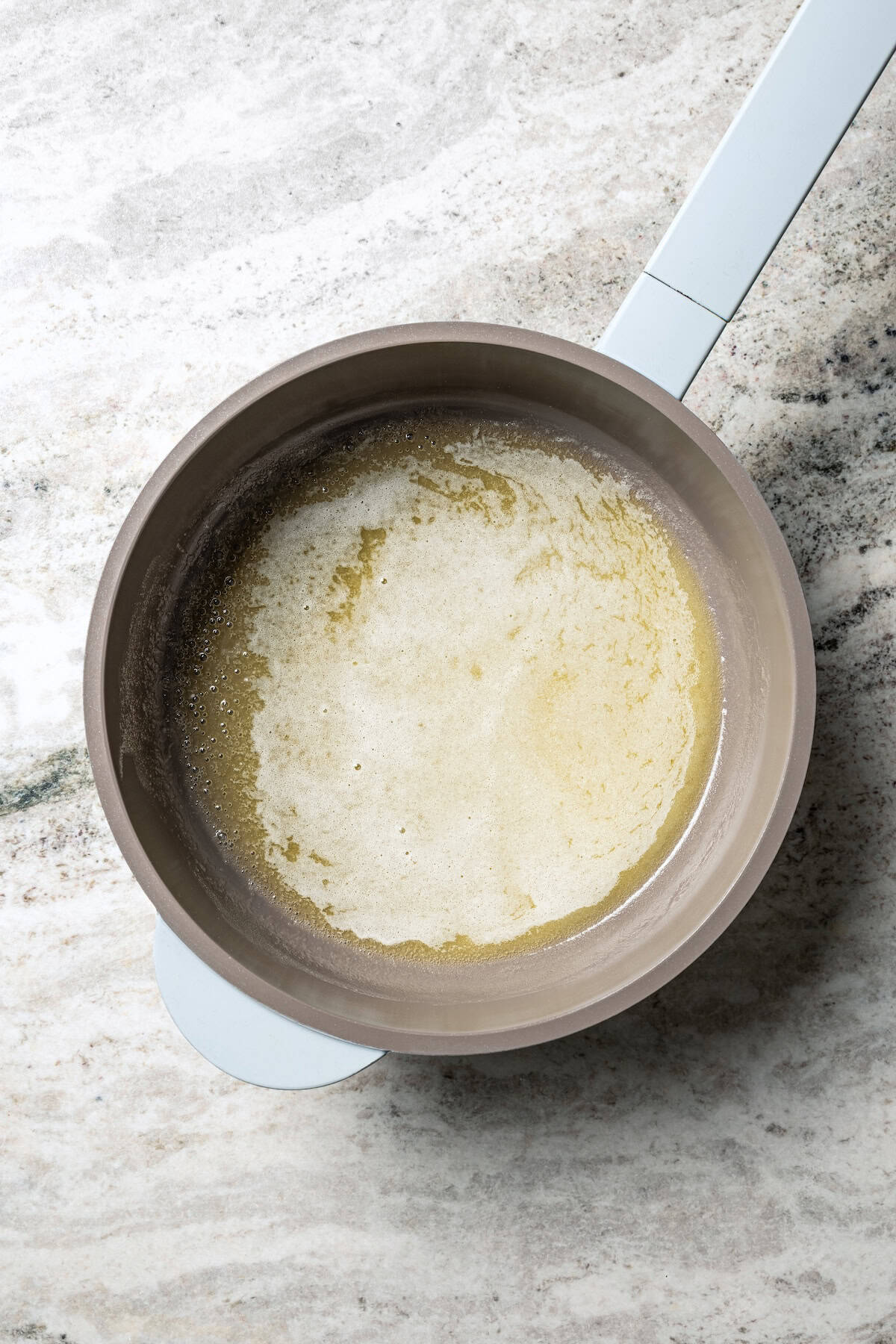 Melted butter in a saucepan.
