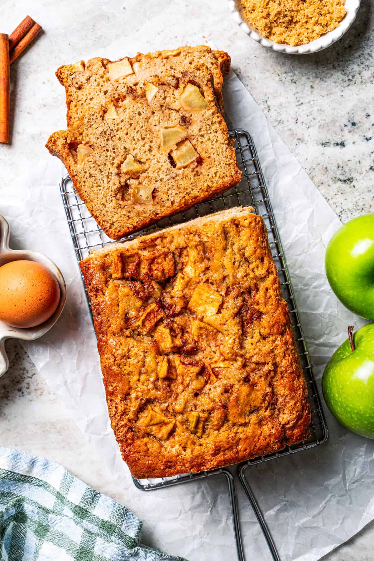 Overhead view of an slice cut from the end of an apple bread loaf.