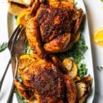 Two Cornish hens on a platter.