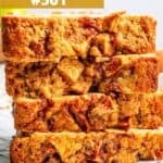 Slices of apple bread stacked up on plate.