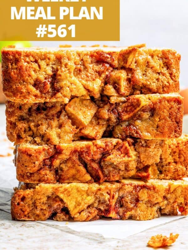 Slices of apple bread stacked up on plate.