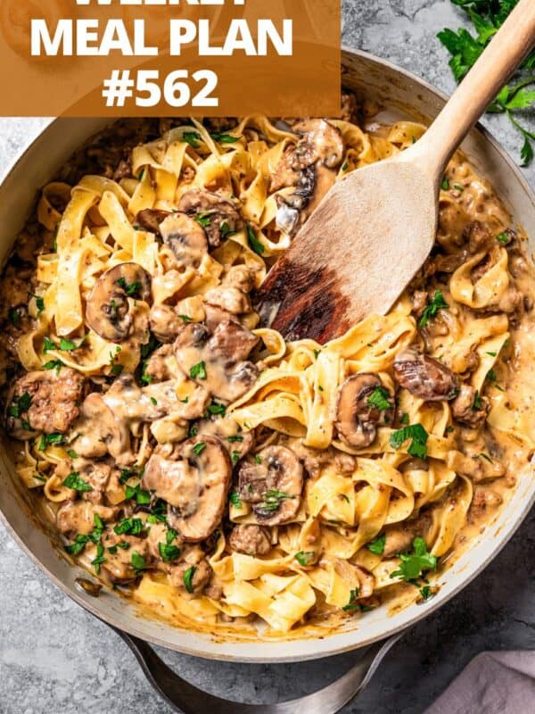 Cooked noodles and beef in a skillet to make beef stroganoff.