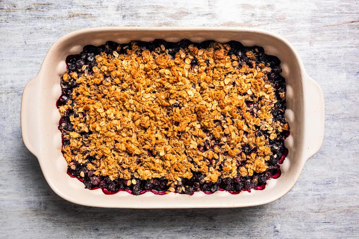 Baked blueberry crisp in a baking dish.