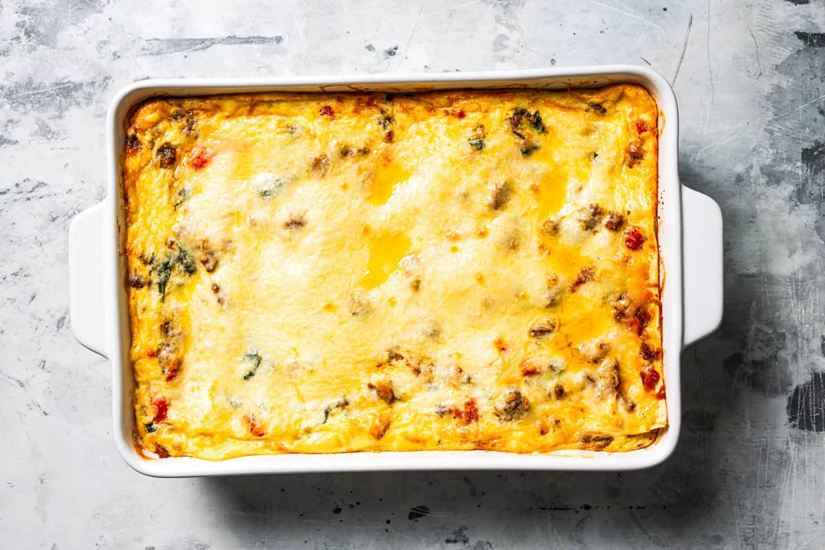 Overhead view of a baked breakfast lasagna in a baking dish.