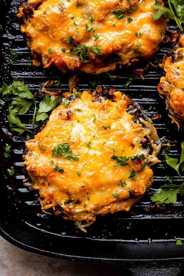 Weekly Meal Plan Portobello mushrooms stuffed with black beans and corn and topped with melted cheese.