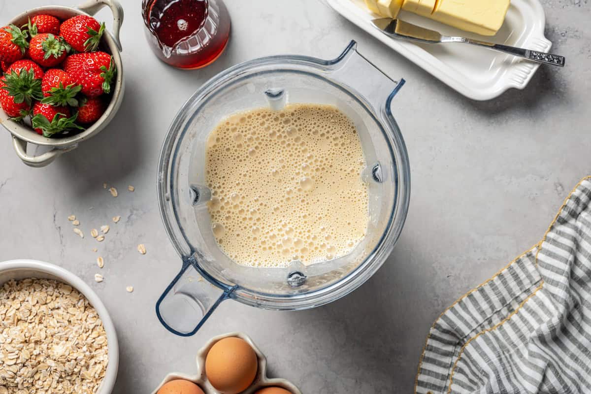 Batter for protein waffles resting inside the blender.