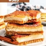 A stack of three churro cheesecake bars on a plate.