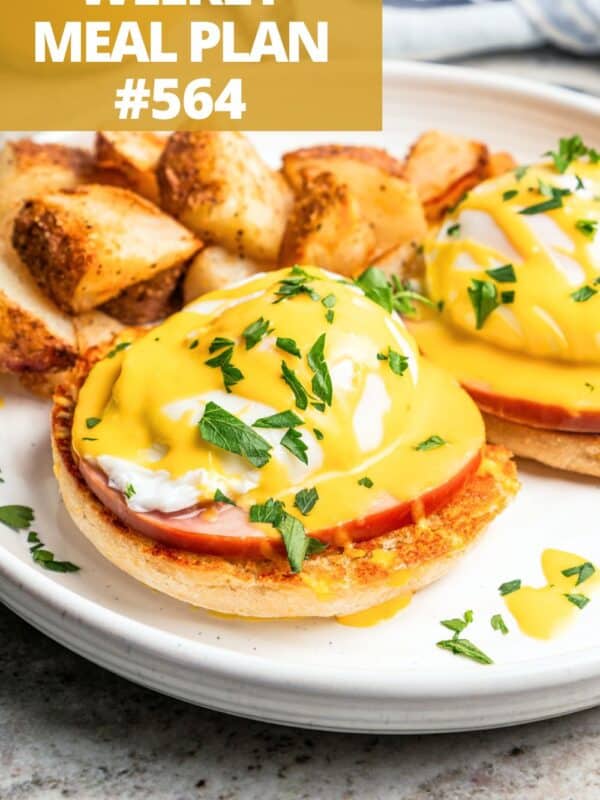 Egg Benedict made with an English muffin, Canadian bacon, a runny egg, and hollandaise sauce.