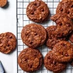 Freshly baked brownie cookies on a wire rack.