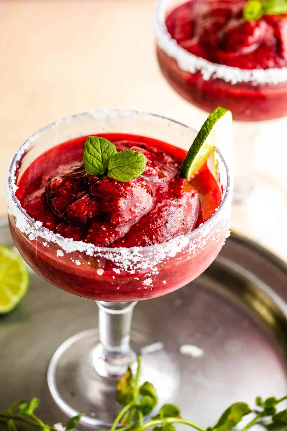 Weekly Meal Plan Frozen berry margaritas served in two margarita drinking glasses.
