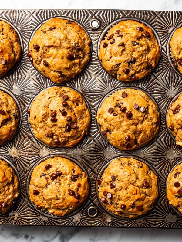Baked peanut butter banana muffins in a muffin pan.
