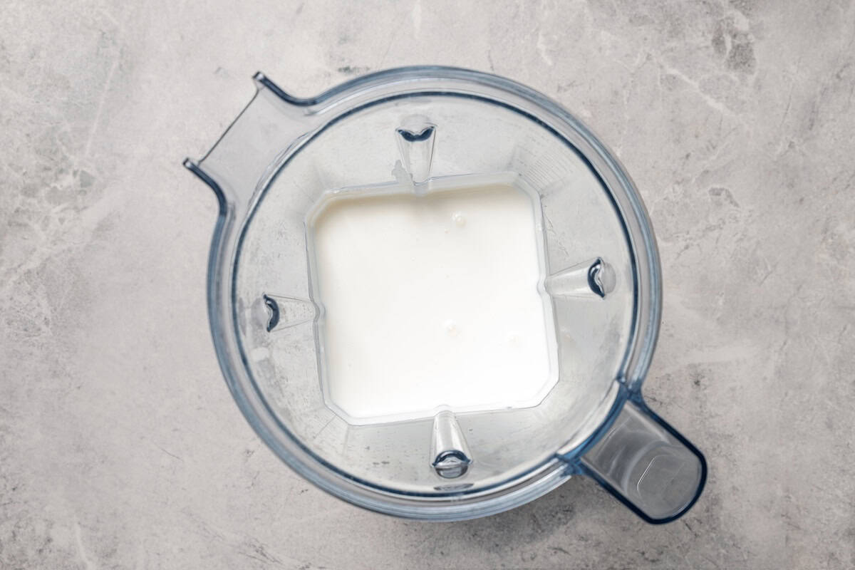 Blended cottage cheese inside the blender.